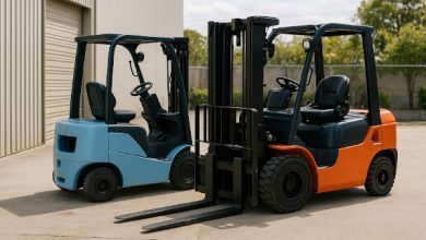 Two forklifts side by side one diesel and one electric